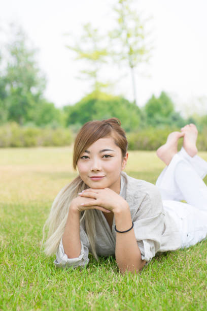 istock Happy woman on the grass 839044256