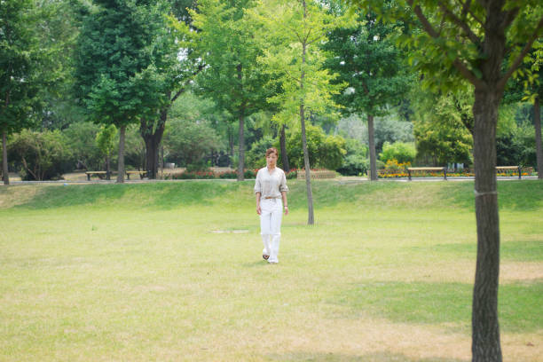 istock woman walking on lawn 839044352