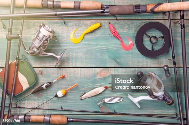 Fishing Theme Frame From Fishing Rods With Fishing Tackles Line Reel And  Fishing Buoy On Green Wooden Background Stock Photo - Download Image Now -  iStock
