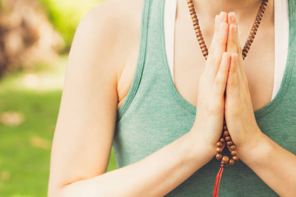 istock Concentrated woman praying wearing rosary beads 839052002