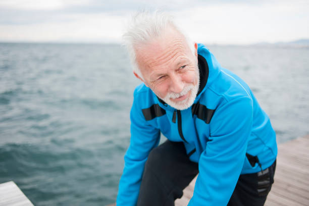 istock Man jogging near sea 839060732