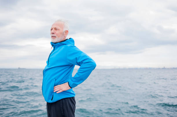 istock Man jogging near sea 839060966