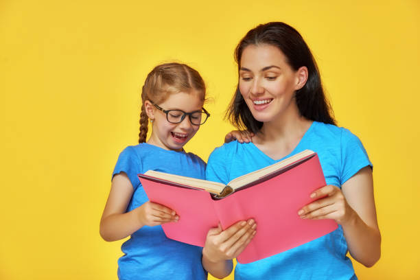 istock child and mother are reading the book 839061172