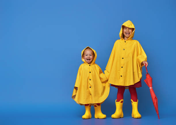 children with red umbrella