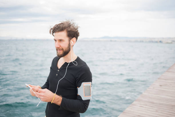 istock Man jogging near sea 839064846