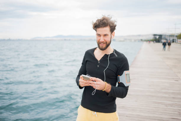 istock Man jogging near sea 839064872