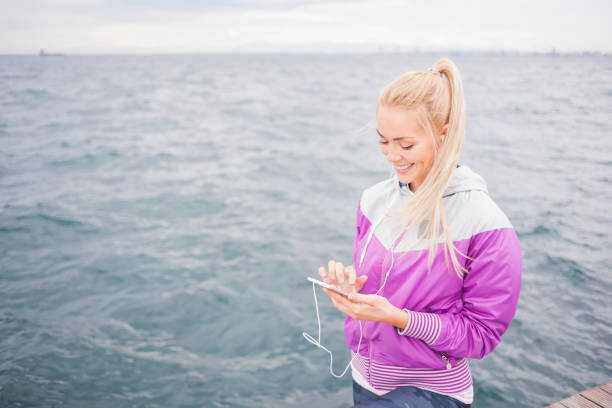istock Woman jogging near sea 839065264