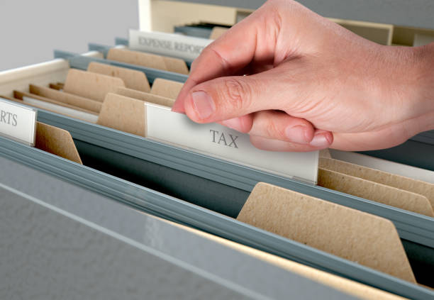 istock Hand Looking Though Filing Cabinet Drawer 839071692