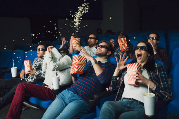 OMG This Is So Scary! Group of people watching 3-D movie at the cinema and reacting to a sudden scary scene 3 d glasses stock pictures, royalty-free photos & images