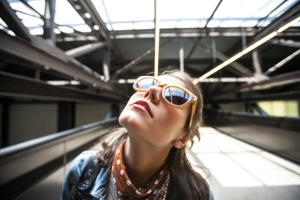 istock Woman on station platform looking up 839073320