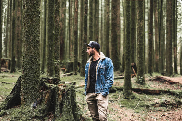 istock solitude traveler walking into the wood 839098474