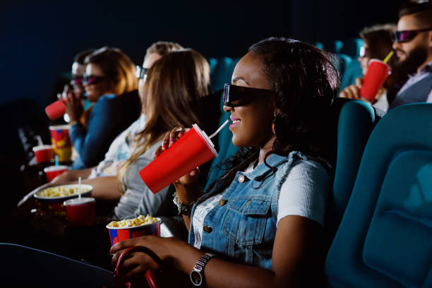 istock Young African woman watching a 3D movie 839100856