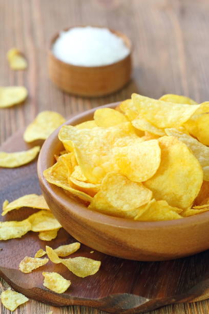 istock Potato chips in bowl. Fast food. 839103274