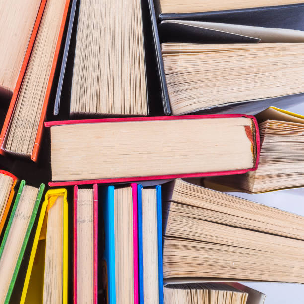 istock Stack of books on a shelf, multicolored book spines. 839109000