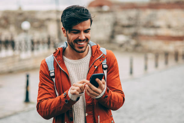 istock Tourist surfing the net outdoors 839111144
