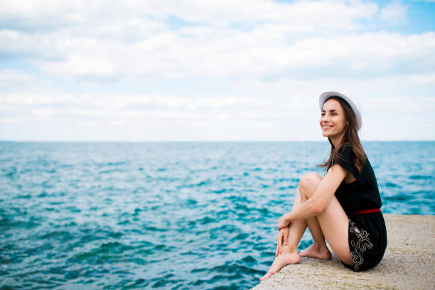 istock Woman relax on the sea background 839111592