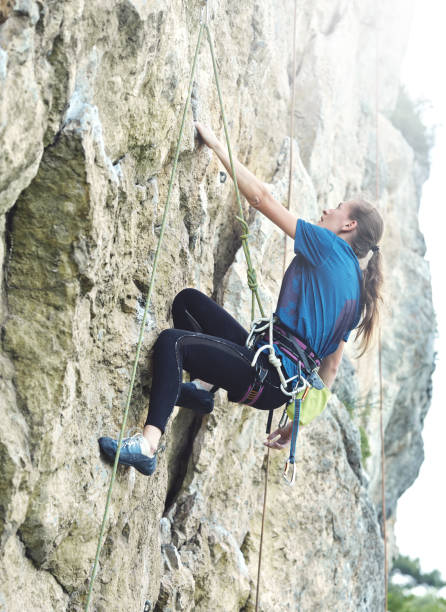 istock woman rock climber on the cliff 839112844