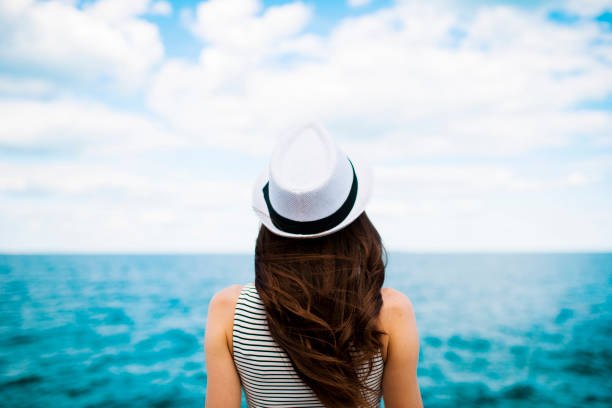 istock Woman looking to the sea 839113582