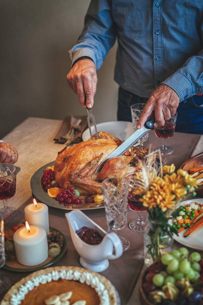 istock Family Having Traditional Holiday Stuffed Turkey Dinner 839114018