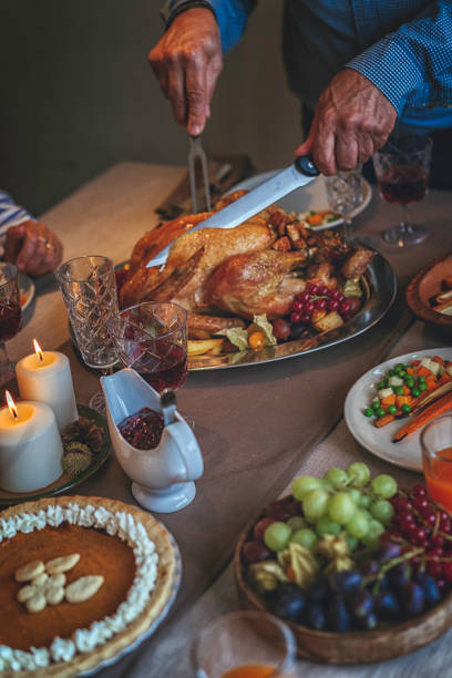 istock Family Having Traditional Holiday Stuffed Turkey Dinner 839114020