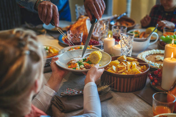 istock Family Having Traditional Holiday Stuffed Turkey Dinner 839114040