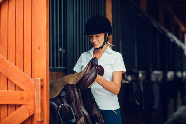 istock Woman in a barn preparing for training 839124880