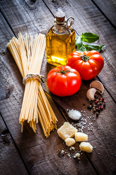 istock Spagetti with ingredients on rustic wooden table 839133774