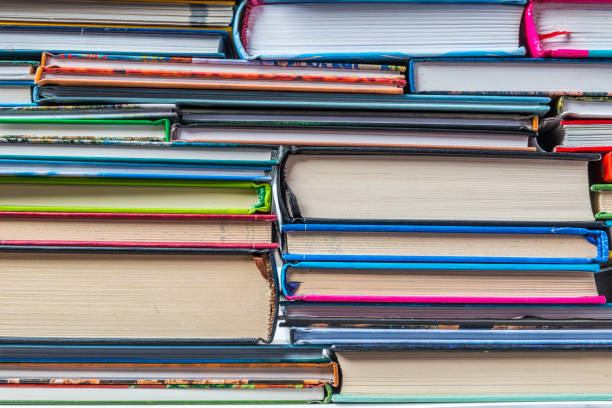 istock Stack of books on a shelf, multicolored book spines. 839147656