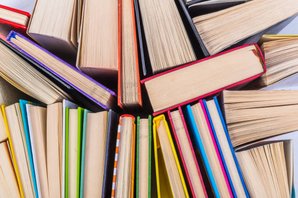 istock Stack of books on a shelf, multicolored book spines. 839150776