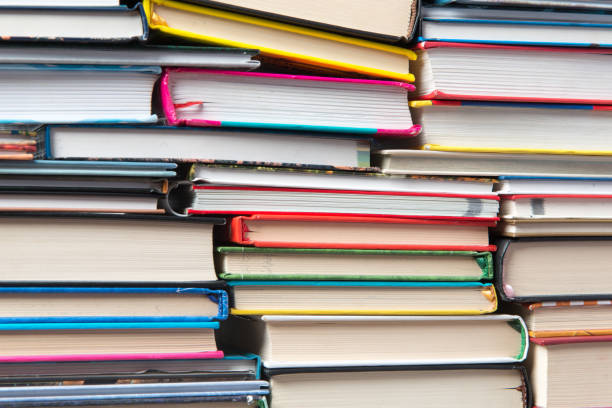 istock Stack of books on a shelf, multicolored book spines. 839153746