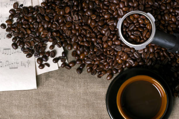 istock Coffee beans, sheet music and Coffee cup on a burlap background 839158354