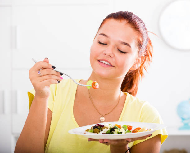 istock girl enjoying salad 839166750