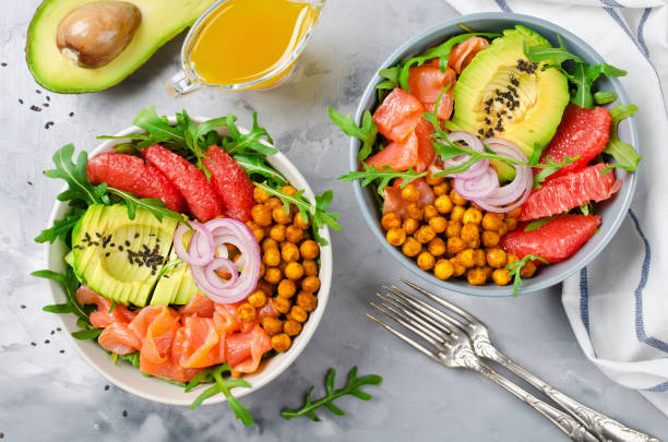 istock Healthy salad bowl with salmon, grapefruit, spicy chickpeas, avocado, red onion and arugula 839169652