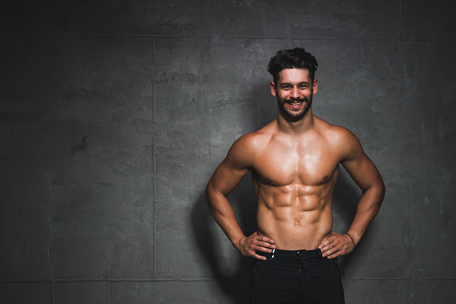 Shot of a handsome and muscular young man posing shirtless in the studio.
