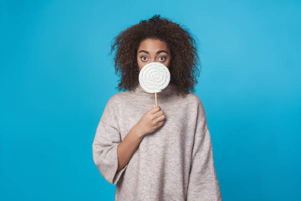 istock Young african woman studio portrait isolated on blue 839175934
