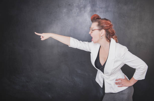 istock Angry screaming teacher pointing out 839180238