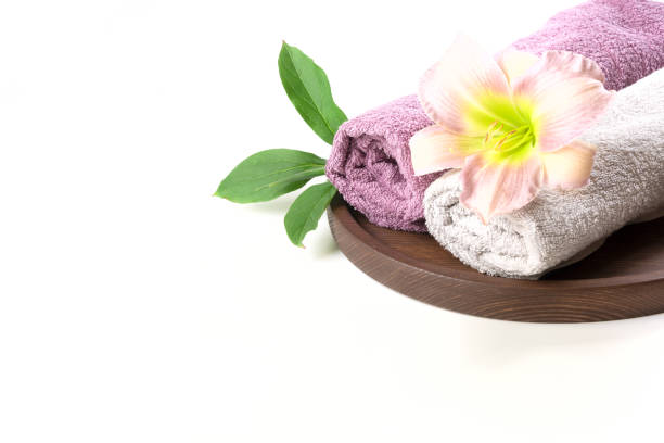 istock Spa setting of towel, flower isolated on white background with copy space. 839187742