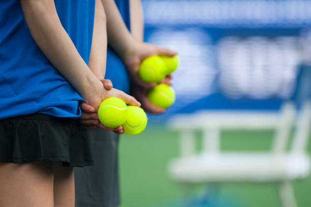 Beautiful female tennis player serving outdoor and a closeup of the serve from above