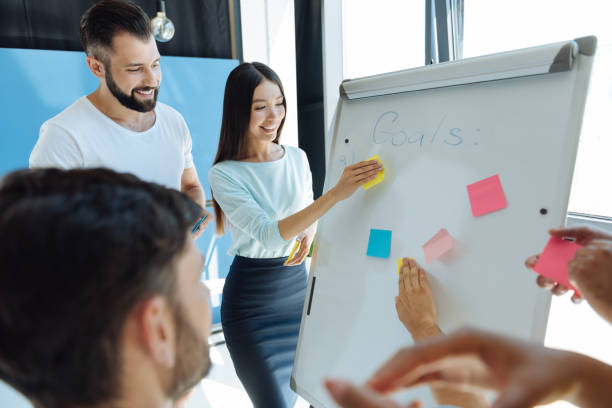 istock Happy young woman holding a sticky note 839199228