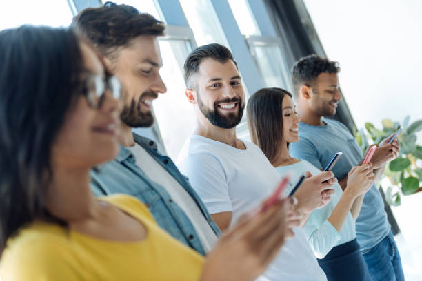 istock Cheerful bearded man standing together with his friends 839205676