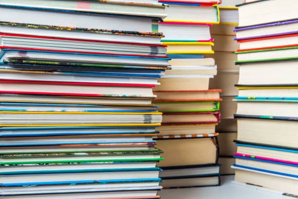 istock Stack of books on a shelf, multicolored book spines. 839222606