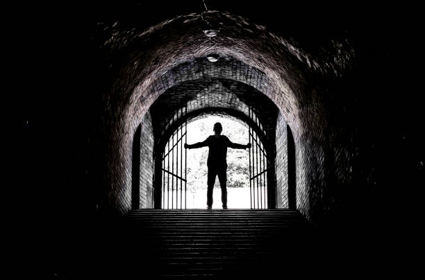 istock Teenager at the end of a dark tunnel 839250412