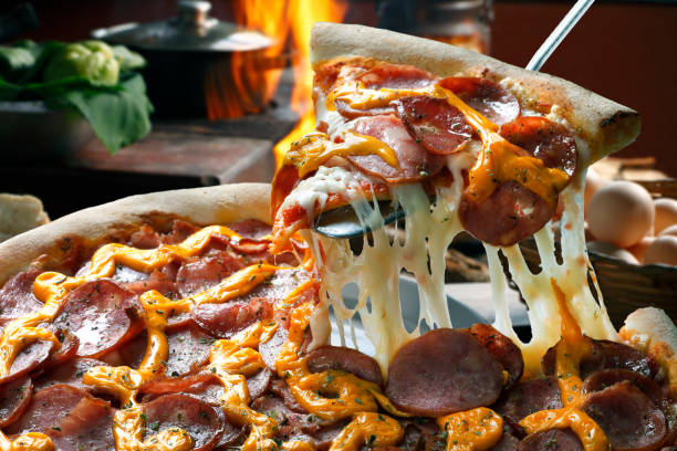 Slice of pizza raised