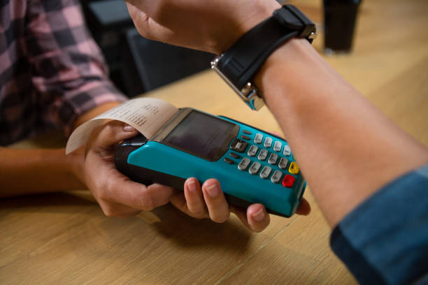istock Cropped hand of customer making payment at bar 839274550