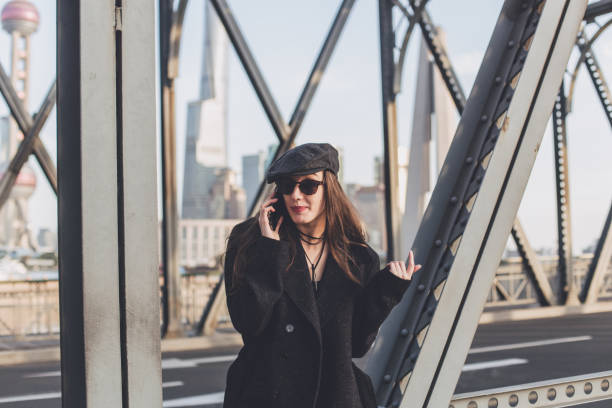 istock Woman outdoors talking on the phone 839282468
