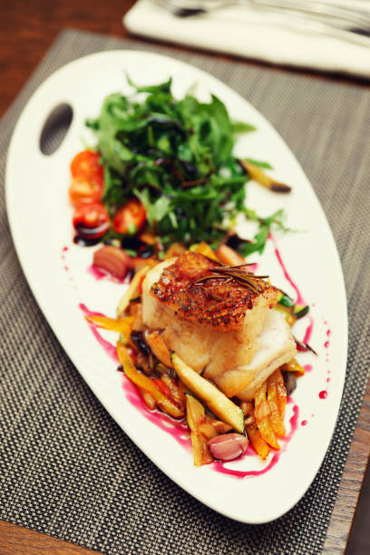 istock White fish fillet with vegetables, toned image 839289144