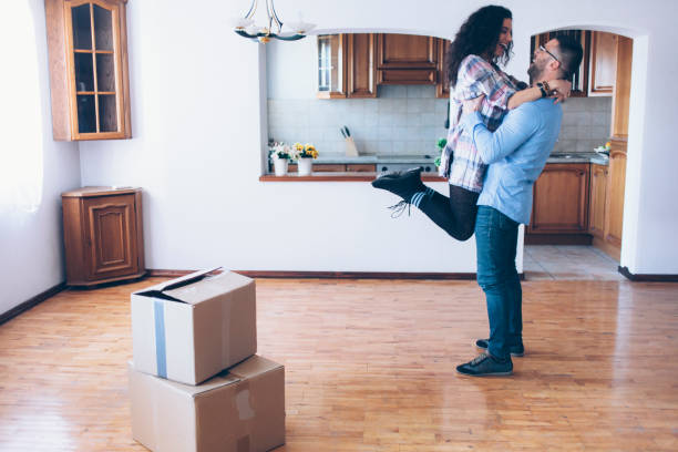 istock Young couple moving in new apartment 839290590