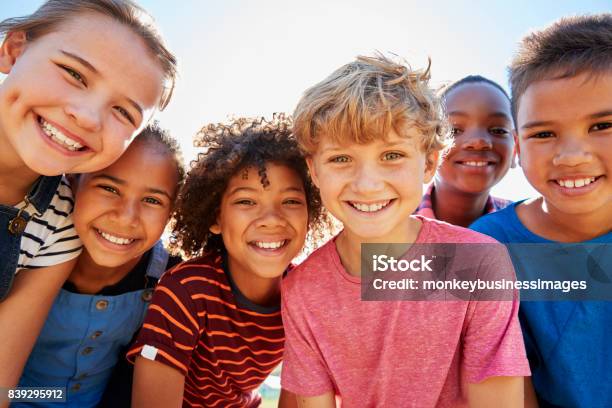 Close Up Of Preteen Friends In A Park Smiling To Camera Stock Photo - Download Image Now