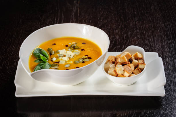 istock Pumpkin and soup with cream and pumpkin seeds 839302474