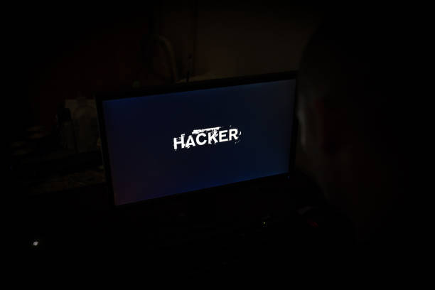 istock Hacker attack the server in the dark.Male hacker technology.Anonymous hacker with laptop in the dark. Cyber security concept. 839303462